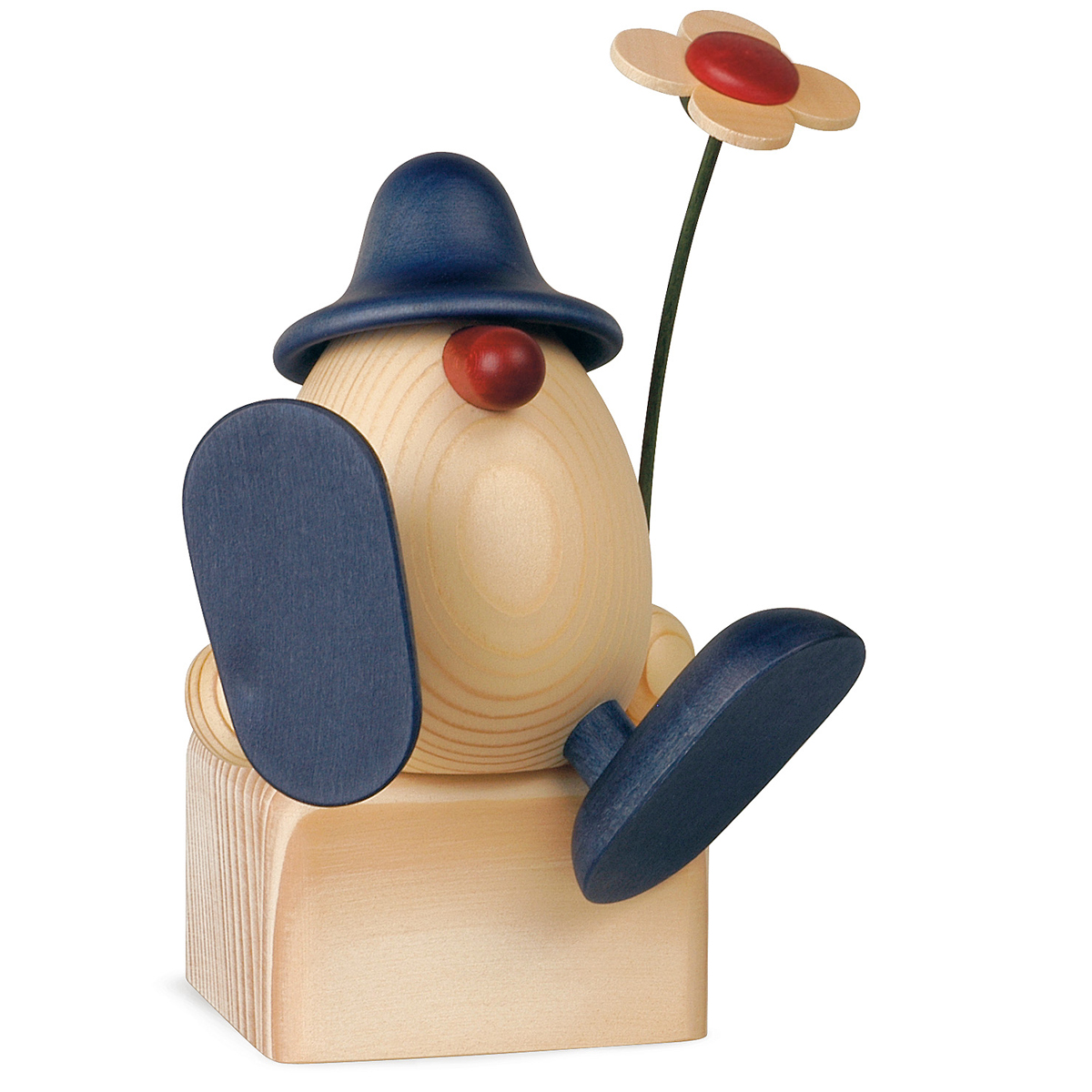 890B_blau_lb Eierkopf Alfons mit Blume auf Kante sitzend/tanzend, blau (ohne Klotz)