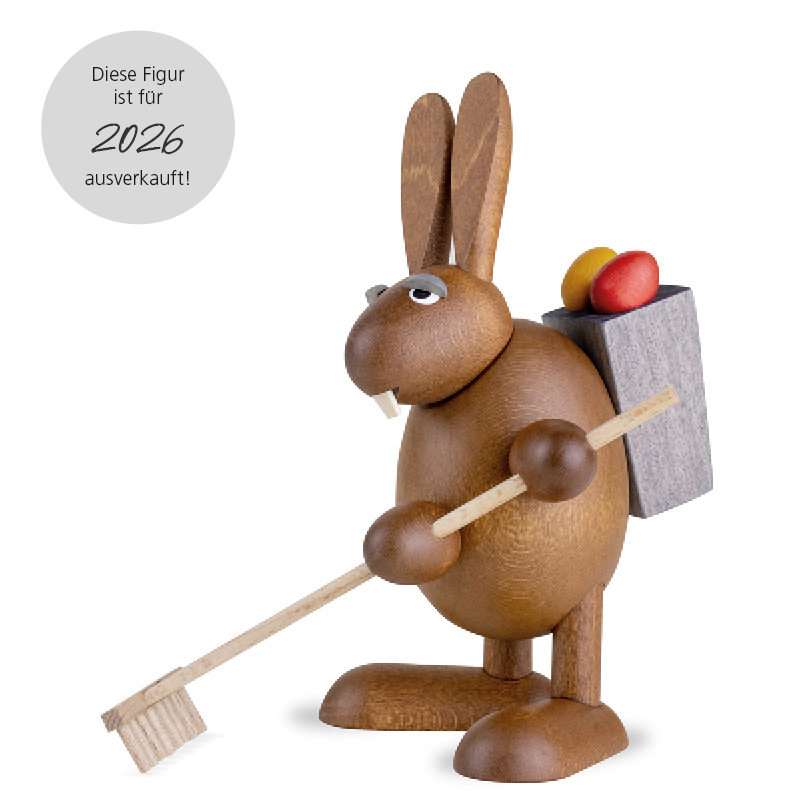 Easter Bunny with garden rake an easter grass